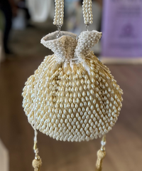 Adara Ivory Suede Potli With Pearl Gold Hanging